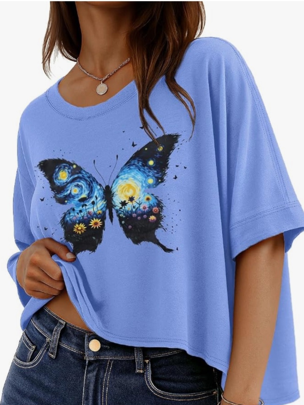 Soft blue women's short-sleeve tee with a vibrant butterfly graphic. Lightweight